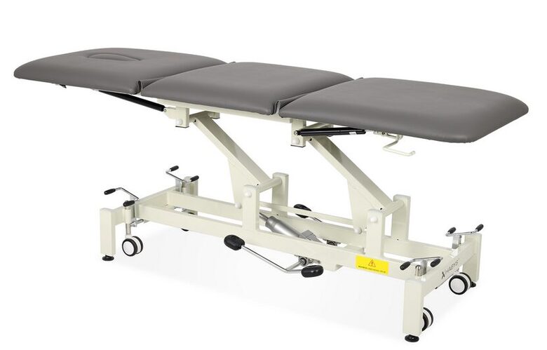 3 segmentu ārstēšanas galds procedūrām un medicīniskām pārbaudēm, diagnostikas procedūrām, masāžai, rehabilitācijai un manuālajai terapijai. HIDRAULISKS. Pelēkā krāsā. Maksimālā pieļaujamā slodze: 230 kg. Medicīnas ierīce